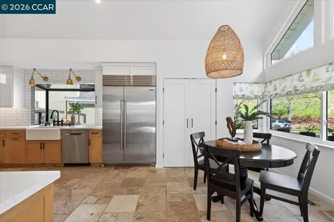 a dining room with furniture and window