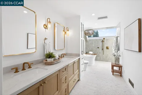 a bathroom with a double vanity sink mirror and double