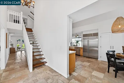 a view of a livingroom with furniture and stairs