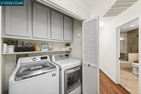 a bedroom with furniture and wooden floor