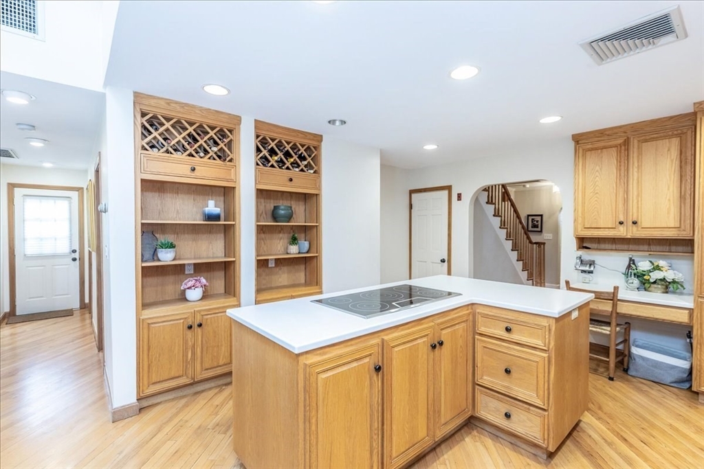 32 Glendale Road Marblehead, MA 01945 - Photo 5 of 42 a kitchen that has a lot of cabinets in it and wooden floors