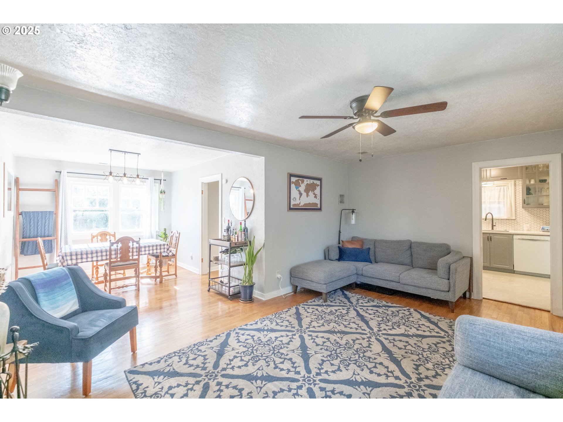 906 Southwest 11th Avenue Albany, OR 97321 - Photo 12 of 48 a living room with furniture and a view of kitchen