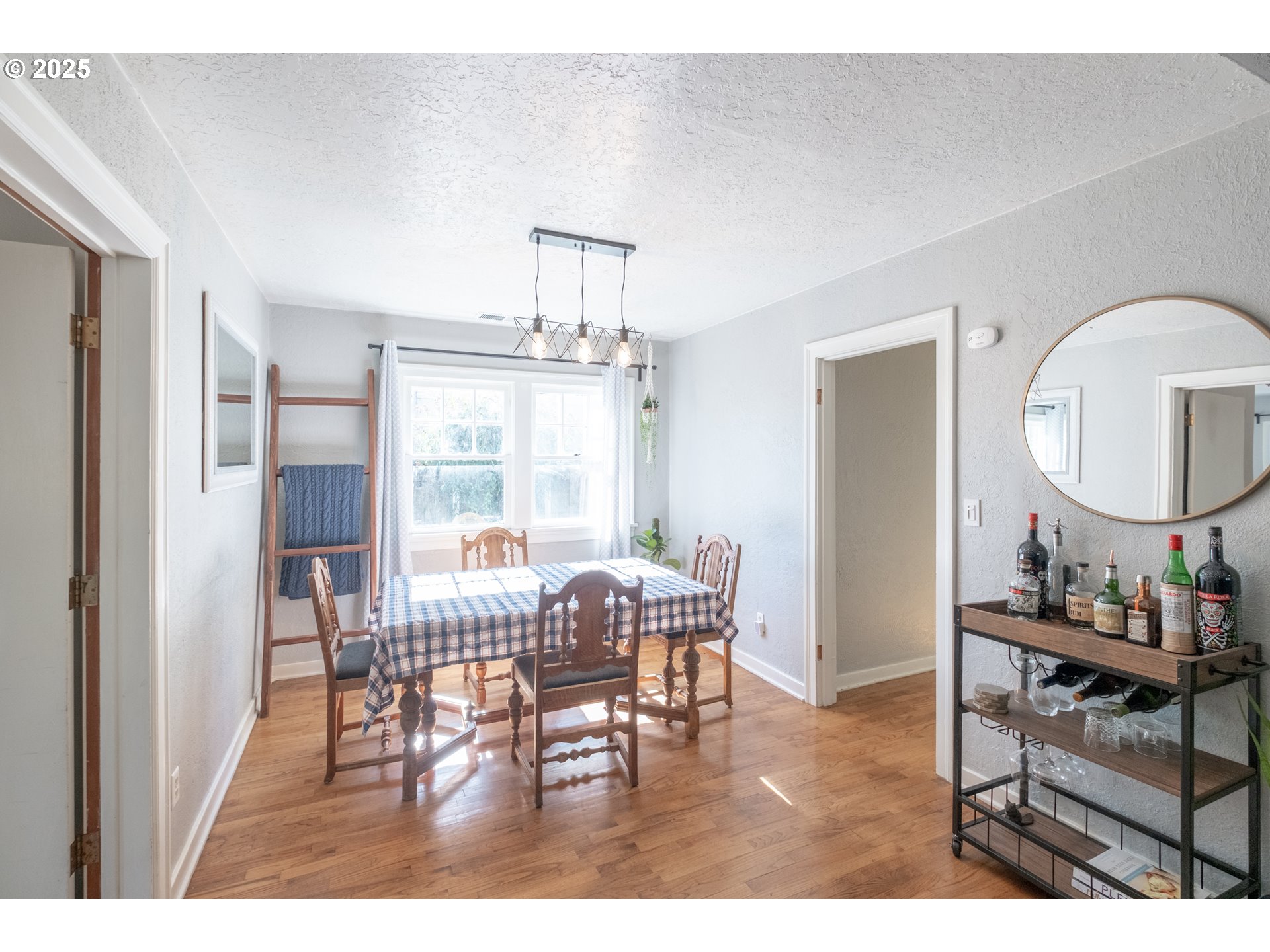 906 Southwest 11th Avenue Albany, OR 97321 - Photo 13 of 48 a view of a dining room with furniture and a chandelier