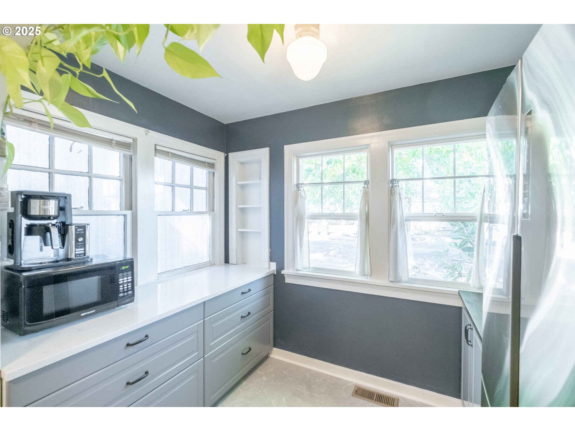 906 Southwest 11th Avenue Albany, OR 97321 - Photo 22 of 48 a kitchen with a window wooden cabinets and stainless steel appliances