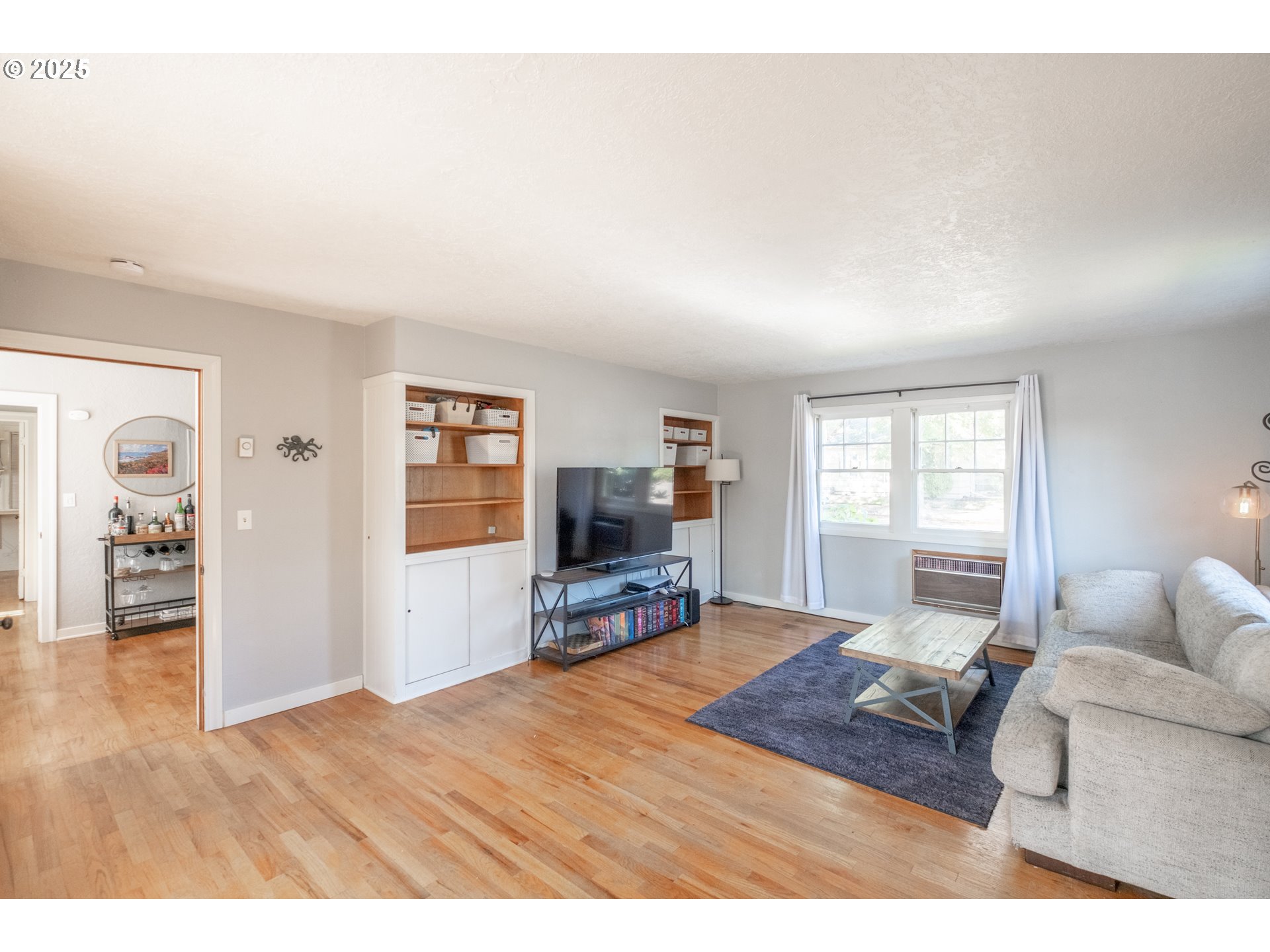 906 Southwest 11th Avenue Albany, OR 97321 - Photo 23 of 48 a bedroom with furniture and a flat screen tv