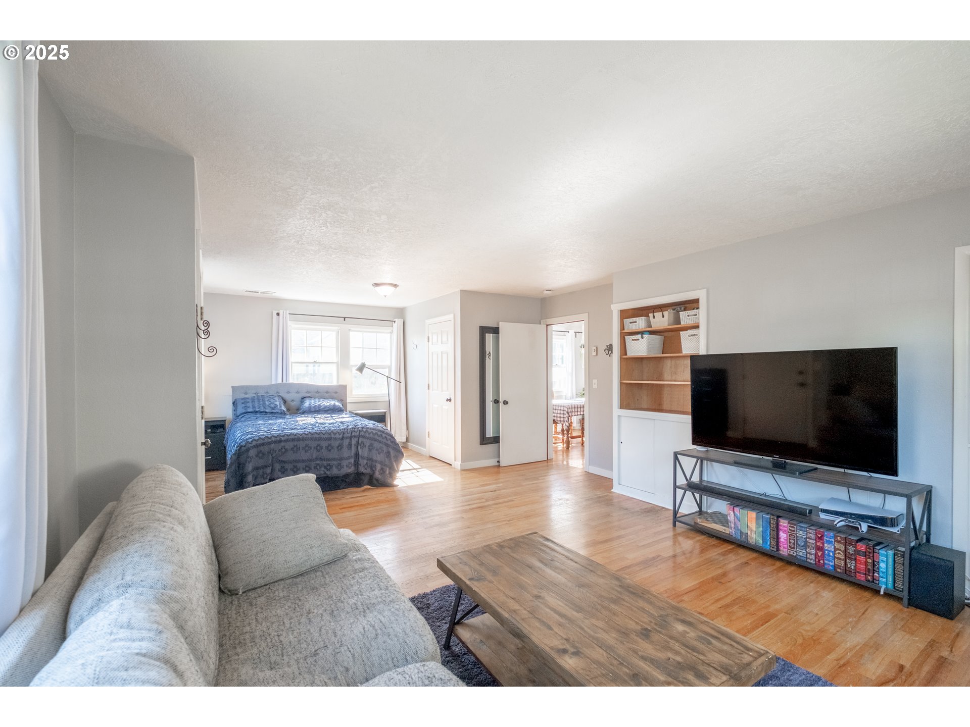 906 Southwest 11th Avenue Albany, OR 97321 - Photo 26 of 48 a living room with furniture and a flat screen tv