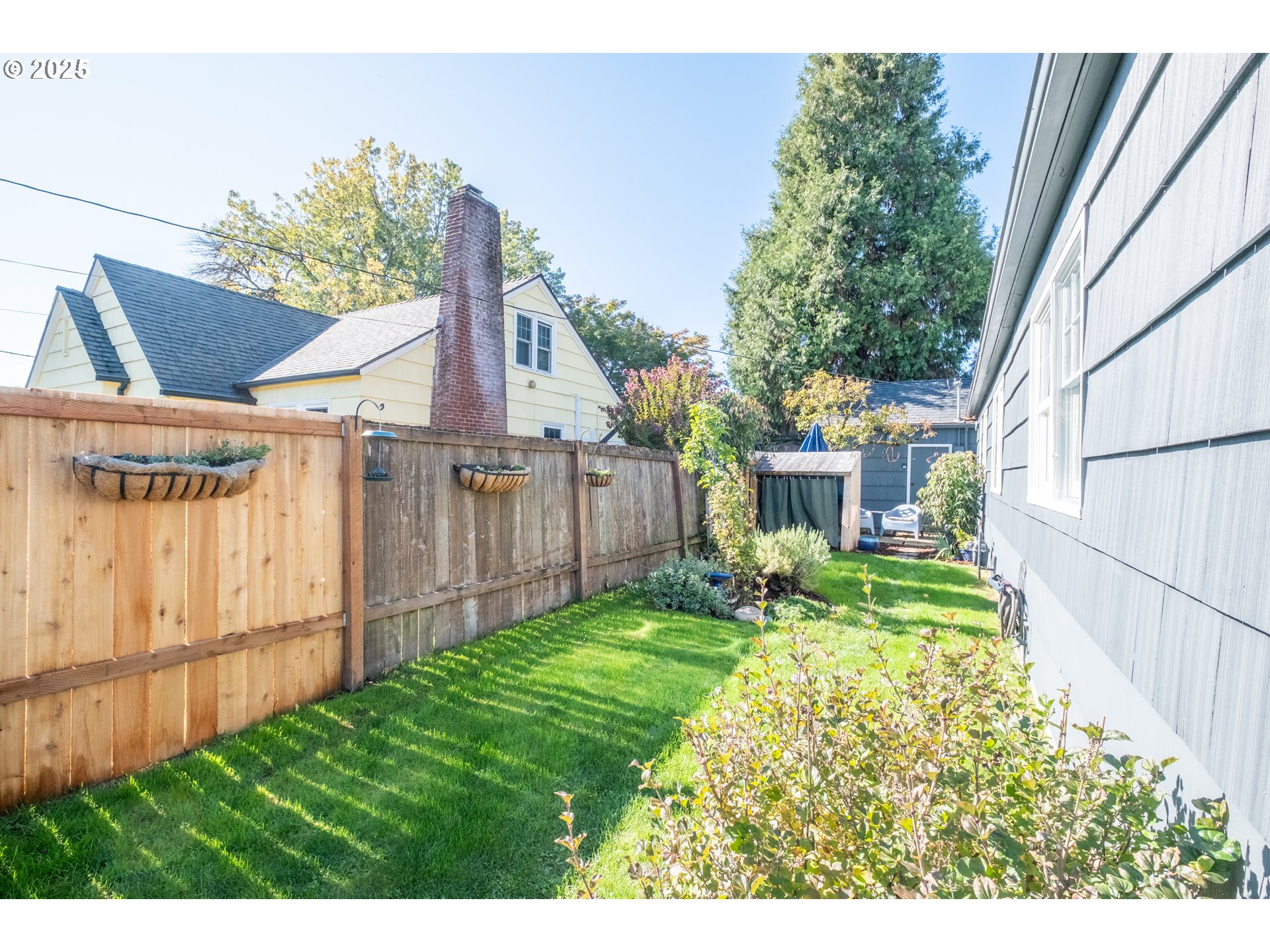 906 Southwest 11th Avenue Albany, OR 97321 - Photo 45 of 48 a view of a backyard with table and chairs and wooden fence