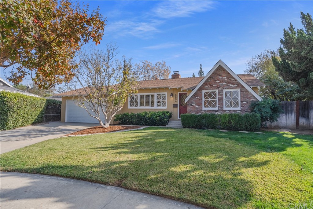 6684 Flory Way Riverside, CA 92504 - Photo 1 of 1 a front view of a house with a garden