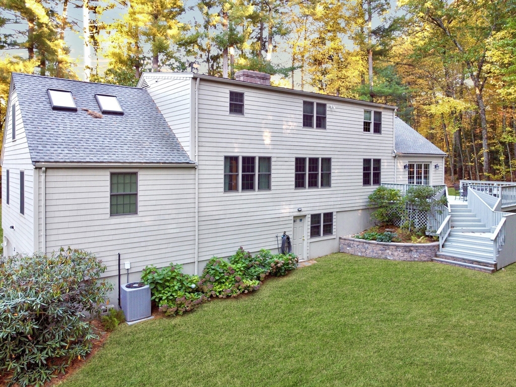 33 Pine Arden Drive West Boylston, MA 01583 - Photo 27 of 32 a front view of a house with a yard and potted plants