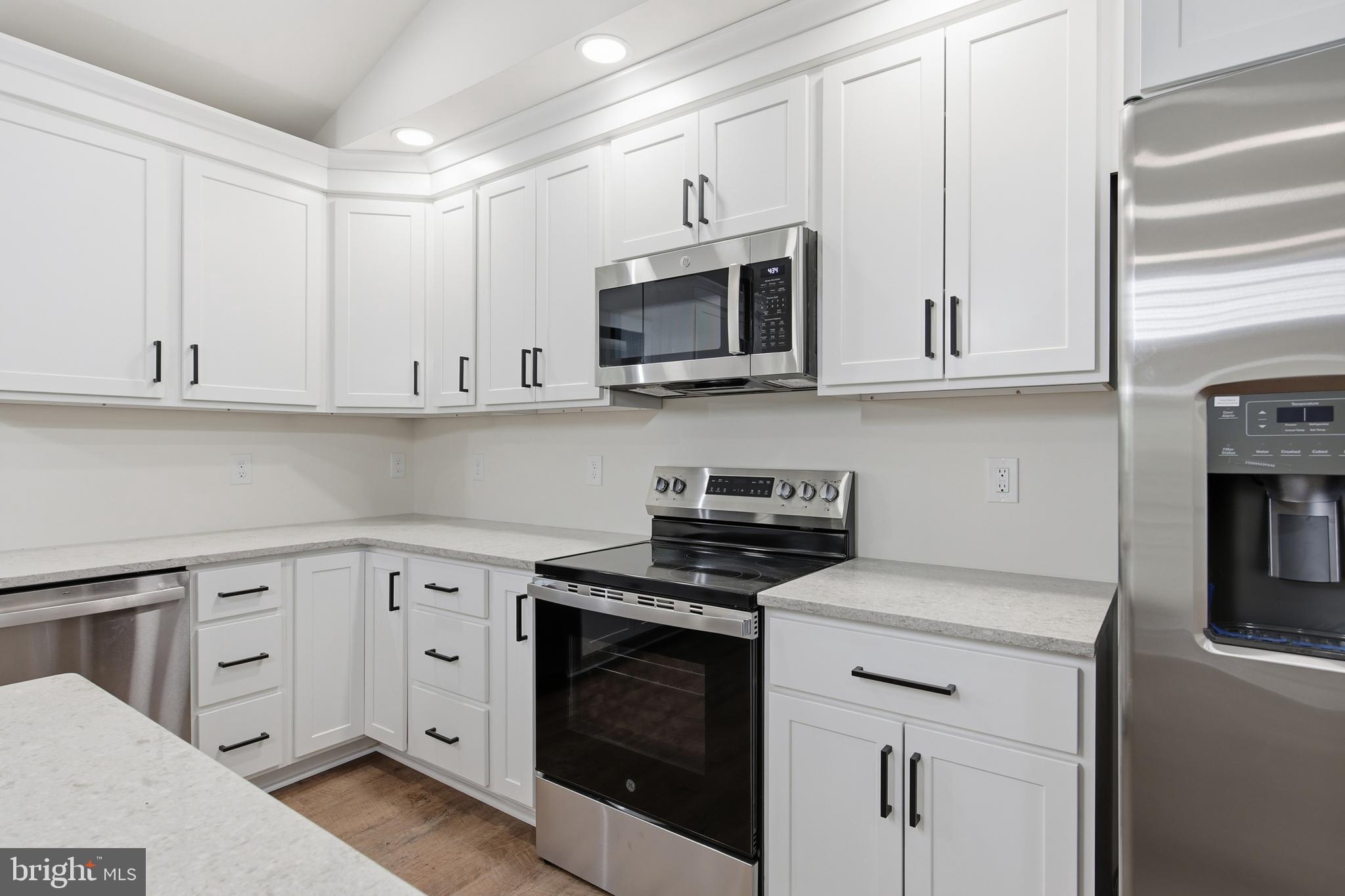 125 Crabapple Road Mount Jackson, VA 22842 - Photo 11 of 51 a kitchen with stainless steel appliances granite countertop grey cabinets a stove a sink and dishwasher