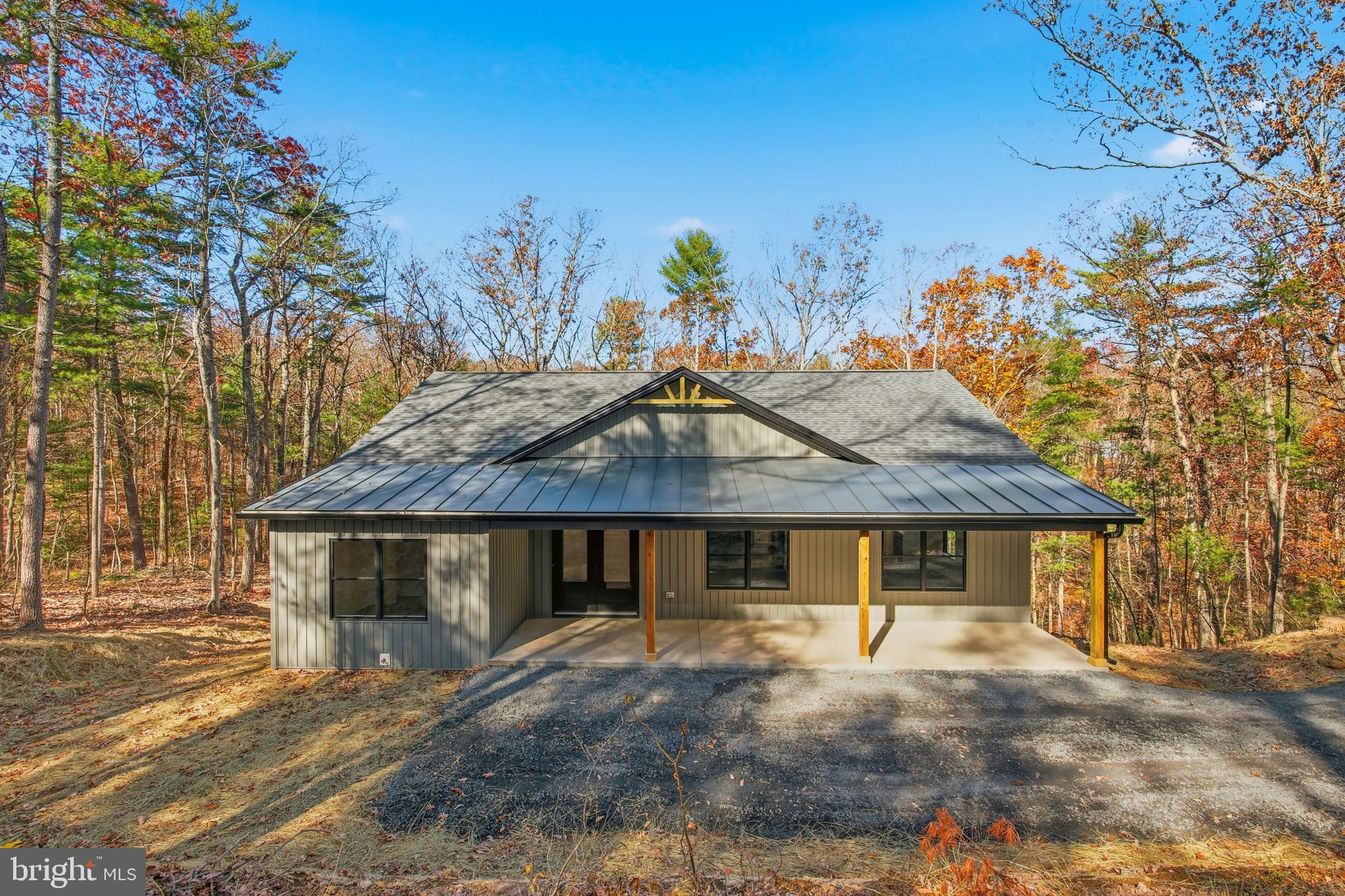 125 Crabapple Road Mount Jackson, VA 22842 - Photo 2 of 51 a front view of a house with a garden