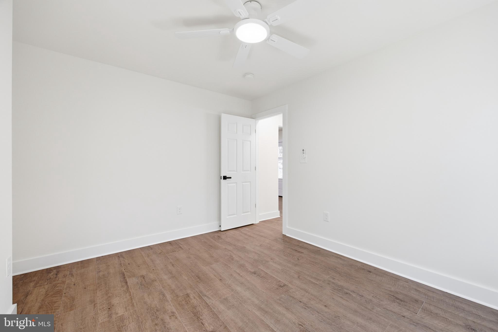 125 Crabapple Road Mount Jackson, VA 22842 - Photo 32 of 51 an empty room with wooden floor and windows