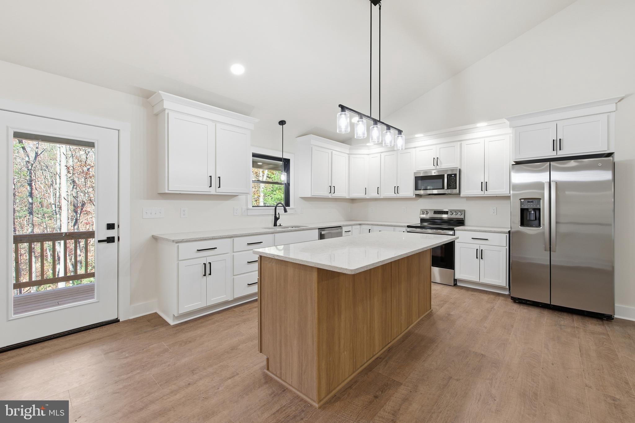 125 Crabapple Road Mount Jackson, VA 22842 - Photo 9 of 51 a kitchen with white cabinets and stainless steel appliances