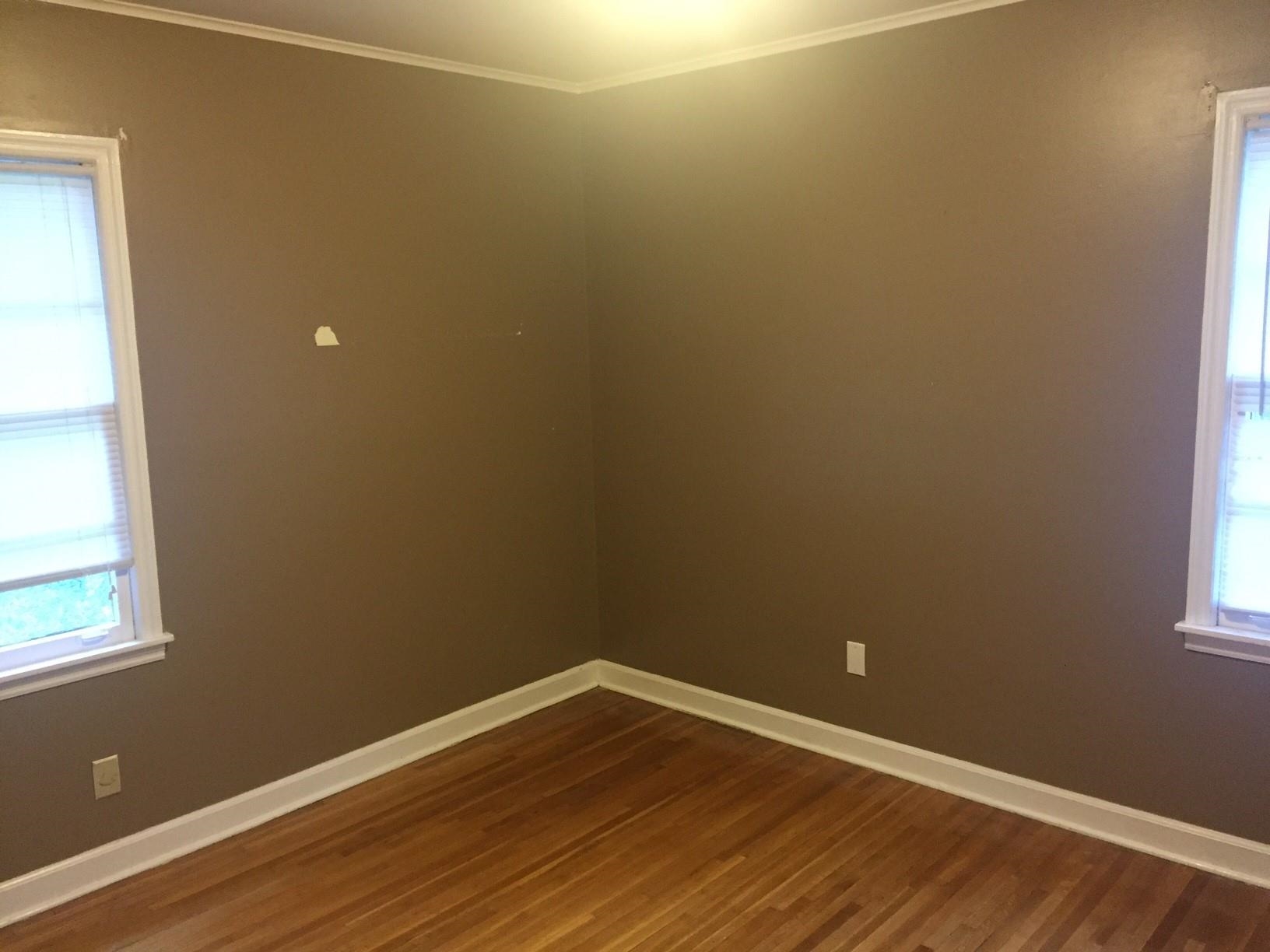 4573 Boyce Road Memphis, TN 38117 - Photo 13 of 18 a view of an empty room with wooden floor and a window