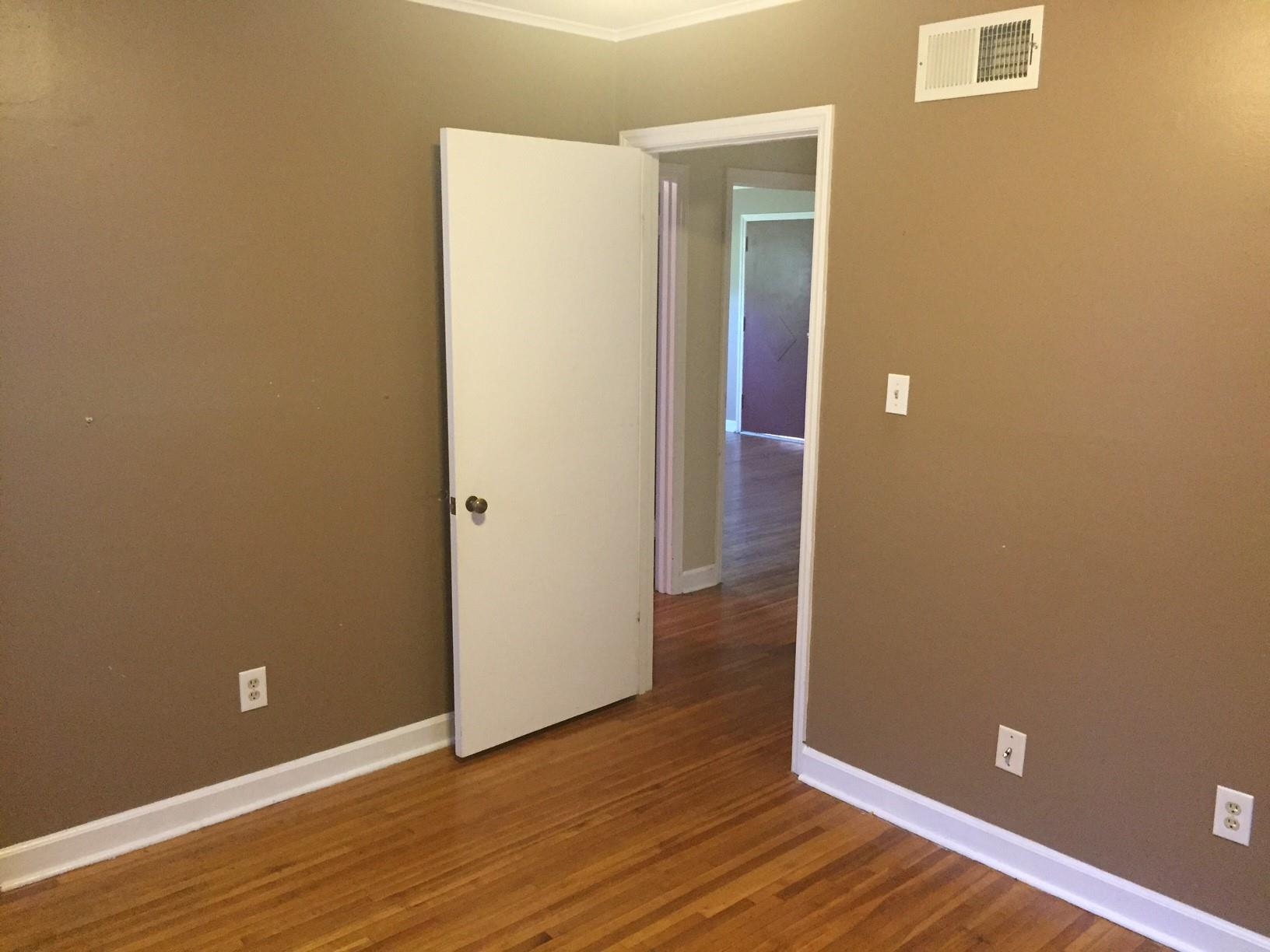4573 Boyce Road Memphis, TN 38117 - Photo 14 of 18 an empty room with wooden floor and closet