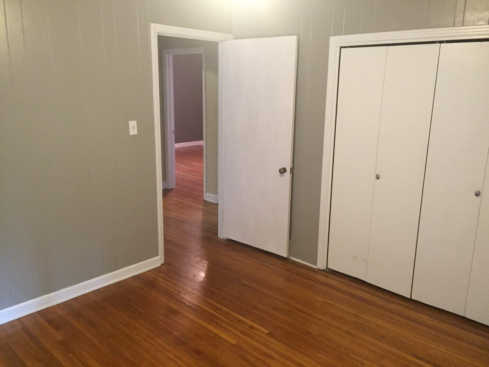 4573 Boyce Road Memphis, TN 38117 - Photo 16 of 18 a view of a hallway with wooden floor