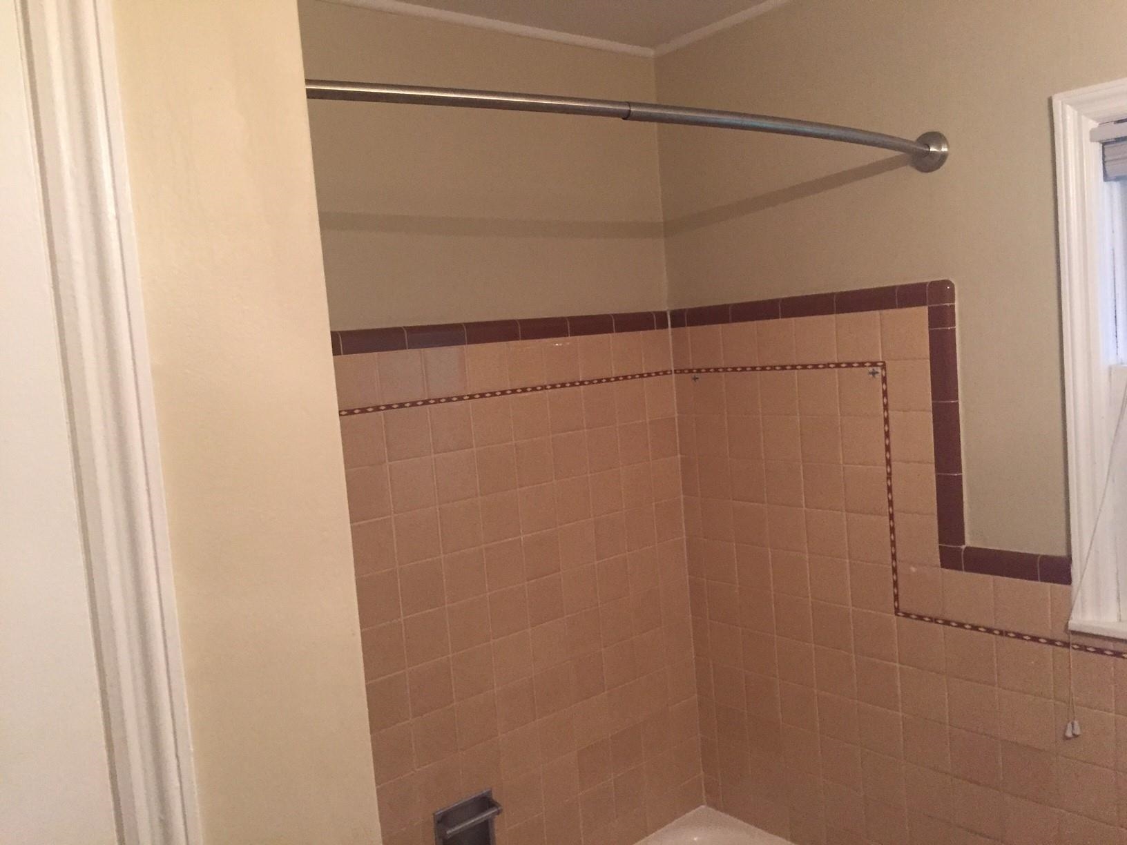 4573 Boyce Road Memphis, TN 38117 - Photo 18 of 18 a bathroom with a glass shower door