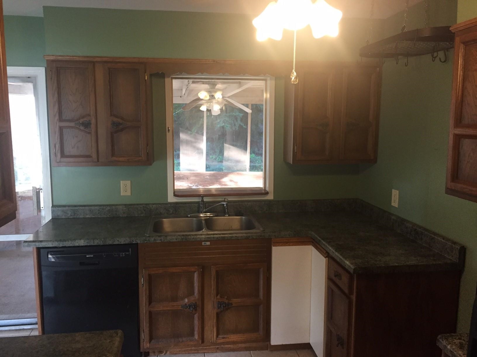 4573 Boyce Road Memphis, TN 38117 - Photo 5 of 18 a kitchen with a sink and cabinets