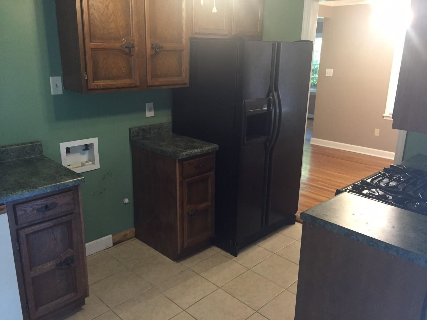 4573 Boyce Road Memphis, TN 38117 - Photo 6 of 18 a kitchen with stainless steel appliances granite countertop a refrigerator and a stove