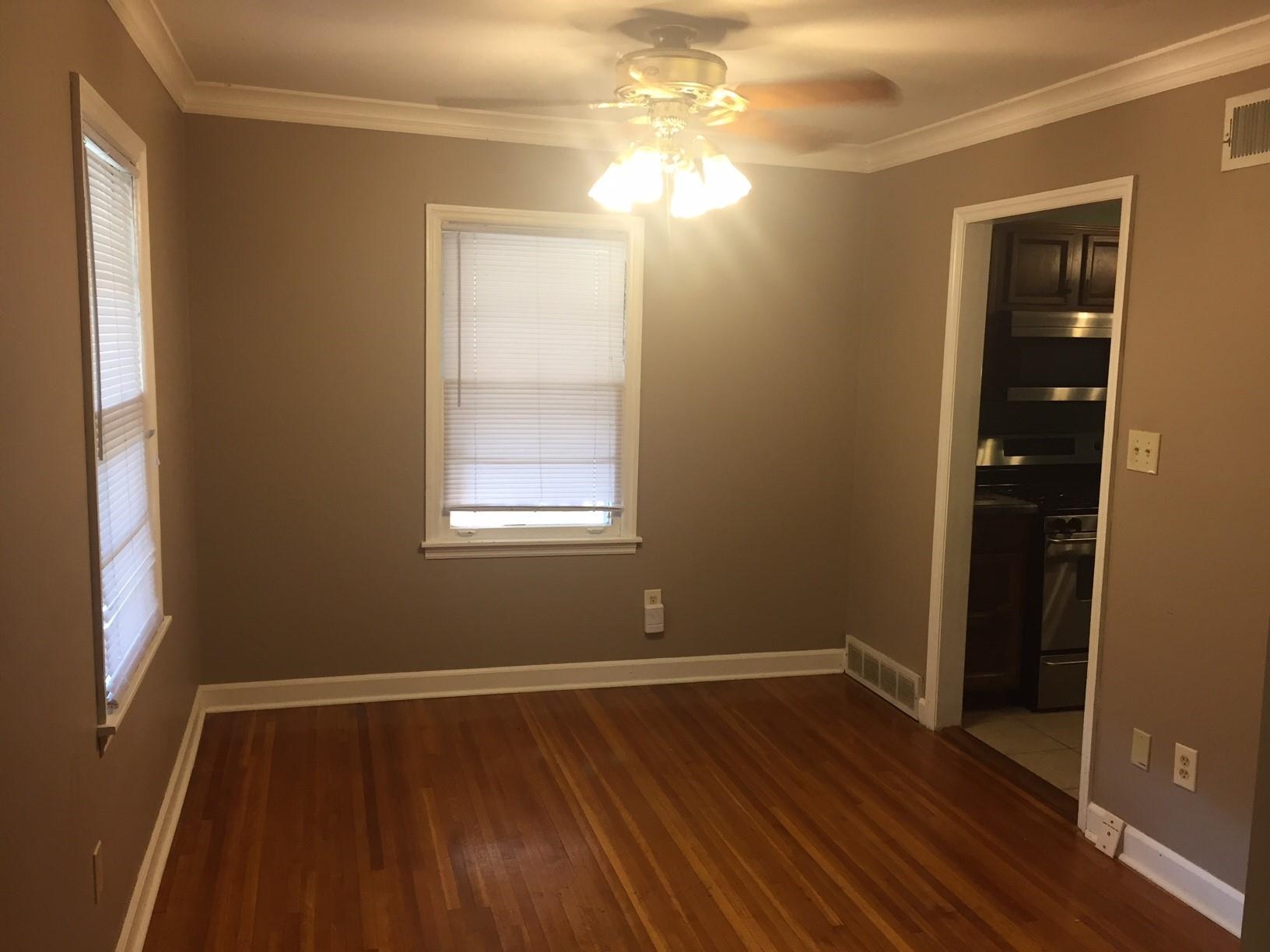 4573 Boyce Road Memphis, TN 38117 - Photo 10 of 18 a view of a room with wooden floor and windows