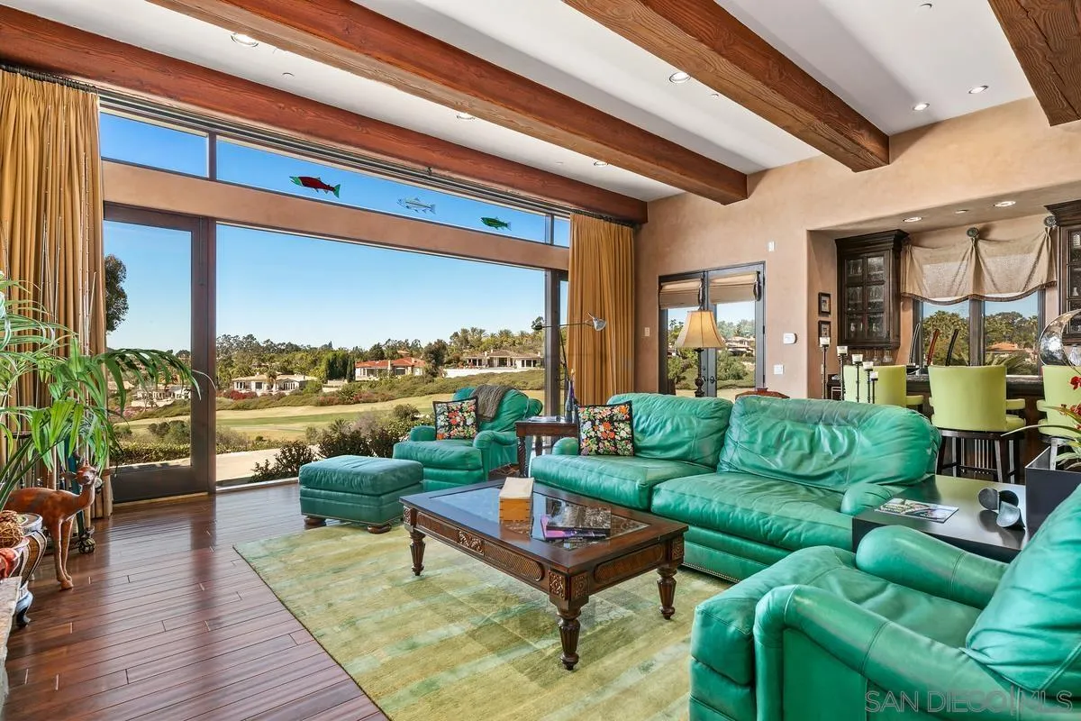 6934 St Andrews Road Rancho Santa Fe, CA 92067 - Photo 13 of 49 a living room with furniture and a large window