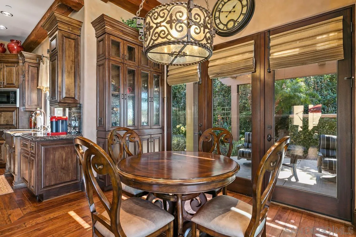 6934 St Andrews Road Rancho Santa Fe, CA 92067 - Photo 17 of 49 a view of a dining room with furniture window and outside view