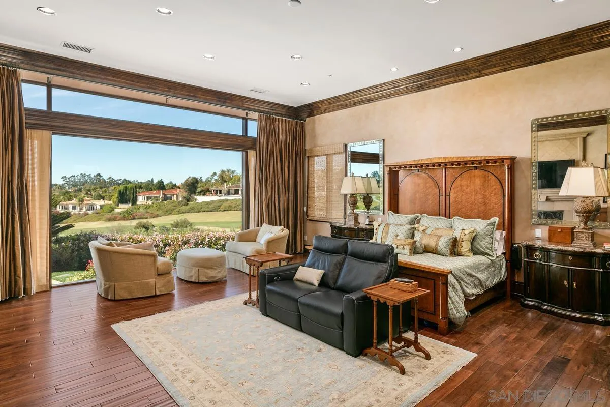 6934 St Andrews Road Rancho Santa Fe, CA 92067 - Photo 22 of 49 a living room with furniture and a large window