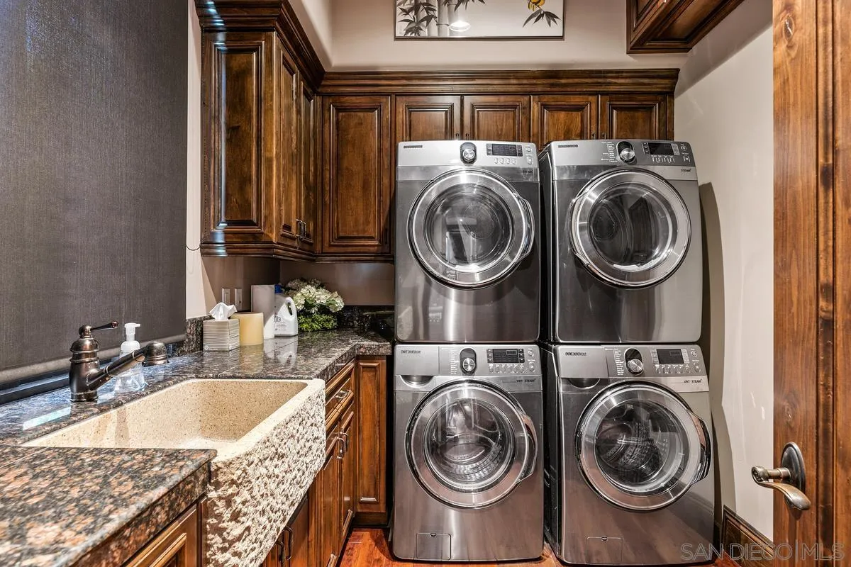 6934 St Andrews Road Rancho Santa Fe, CA 92067 - Photo 34 of 49 a utility room with sink dryer and washer
