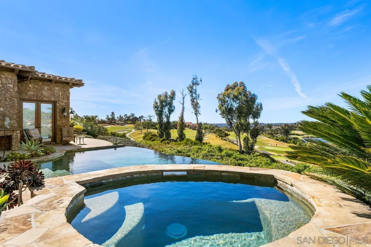 6934 St Andrews Road Rancho Santa Fe, CA 92067 - Photo 38 of 49 a view of a swimming pool with an outdoor space