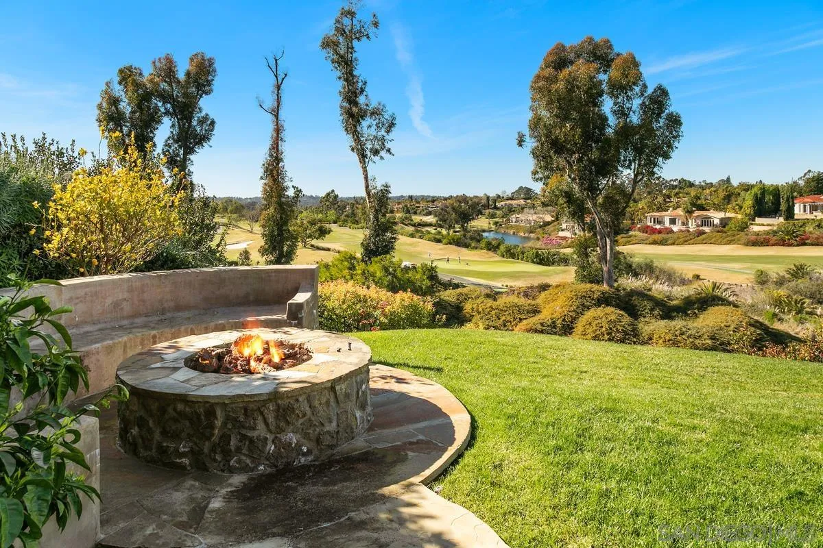 6934 St Andrews Road Rancho Santa Fe, CA 92067 - Photo 42 of 49 a view of a swimming pool with a yard