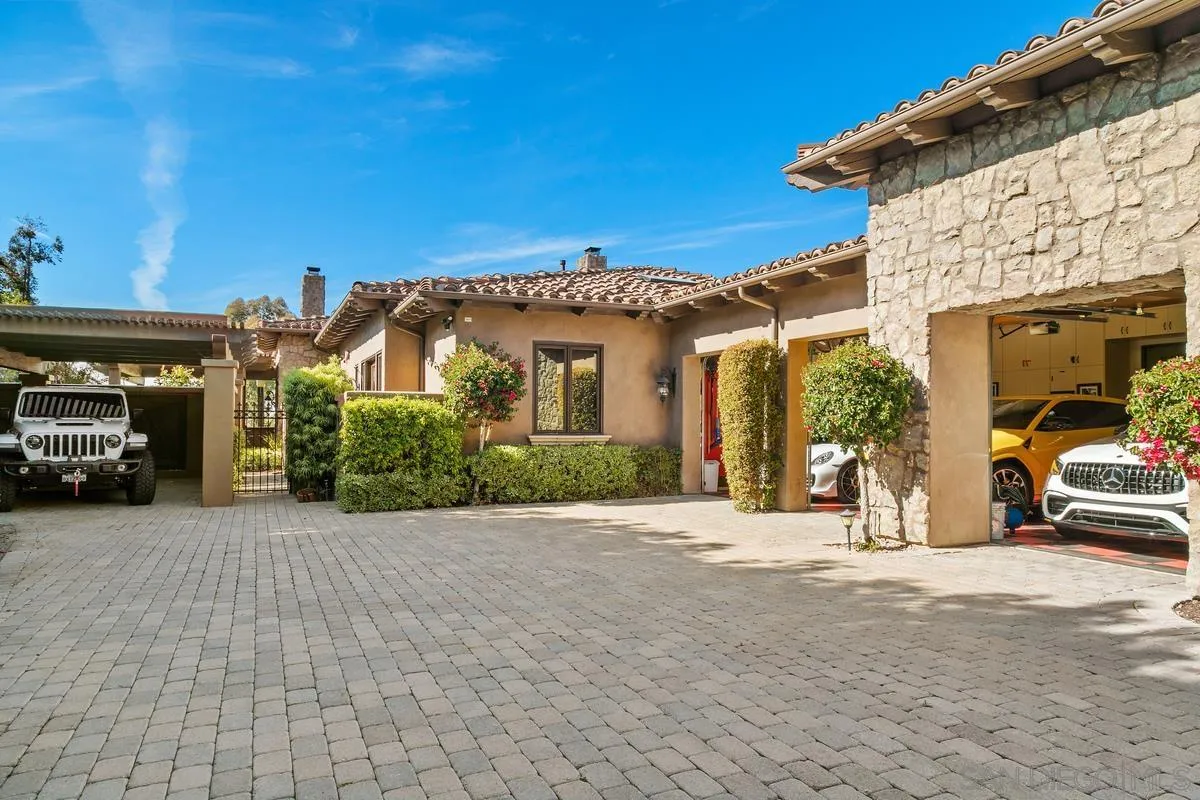 6934 St Andrews Road Rancho Santa Fe, CA 92067 - Photo 44 of 49 a view of a car park in front of a building