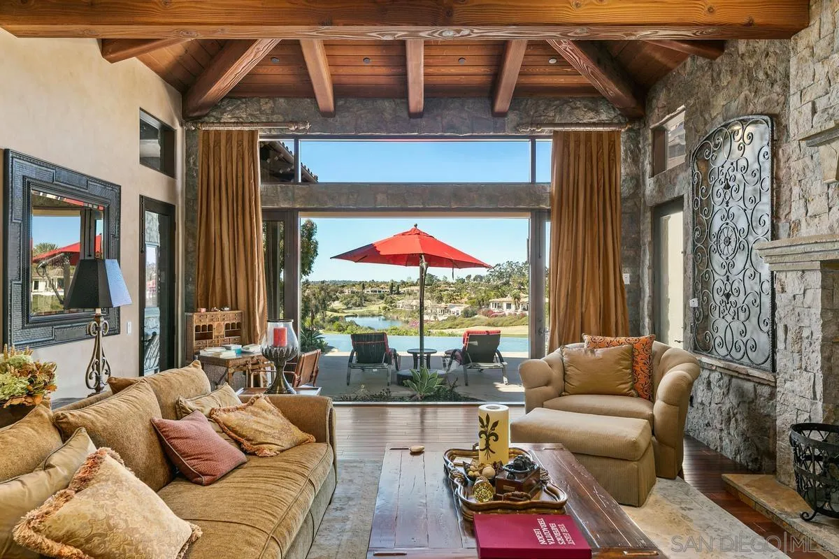 6934 St Andrews Road Rancho Santa Fe, CA 92067 - Photo 9 of 49 a living room with furniture ceiling fan and a rug