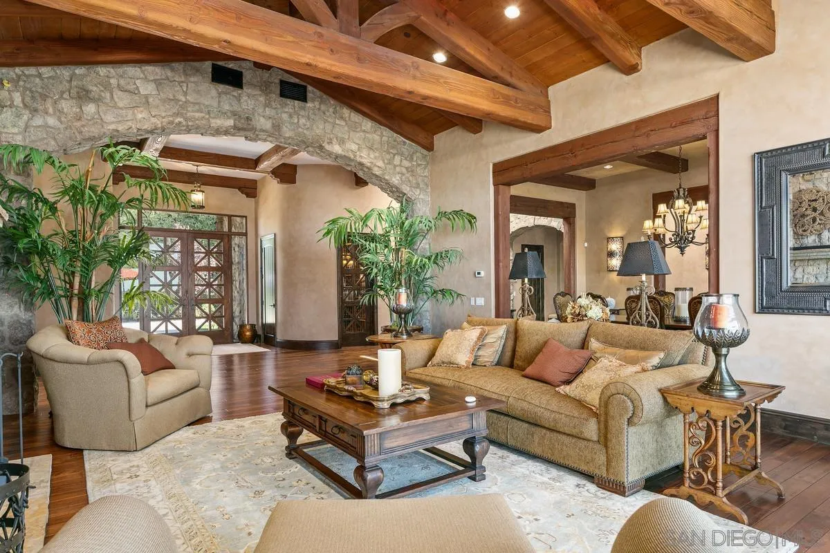 6934 St Andrews Road Rancho Santa Fe, CA 92067 - Photo 10 of 49 a living room with furniture and a large window