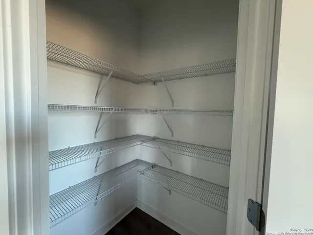 a empty closet with white paint