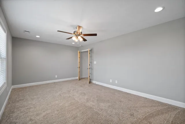 a view of a backyard with a garden and deck
