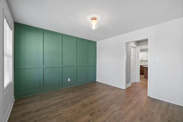 a bathroom with a sink toilet and a mirror