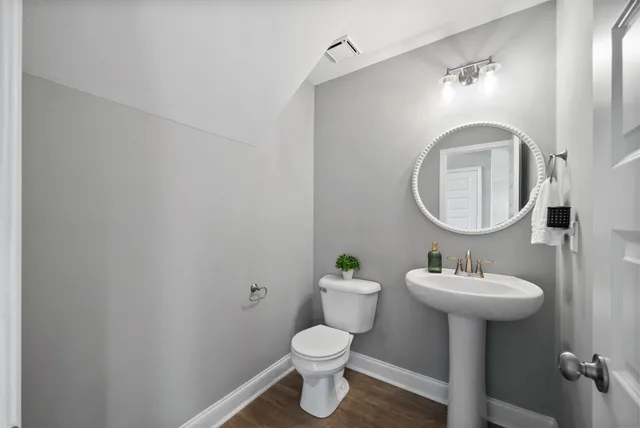 a kitchen with stainless steel appliances granite countertop a stove top oven a sink and a refrigerator