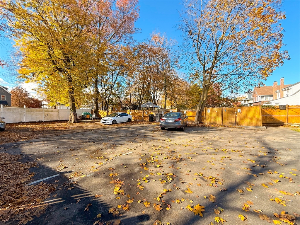 41 Pond Street, Unit 1 Framingham, MA 01702 - Photo 15 of 15 a view of road with large trees