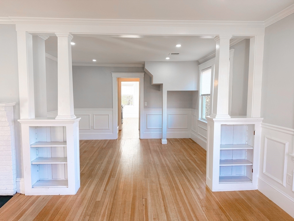 41 Pond Street, Unit 1 Framingham, MA 01702 - Photo 4 of 15 wooden floor in an empty room with a window