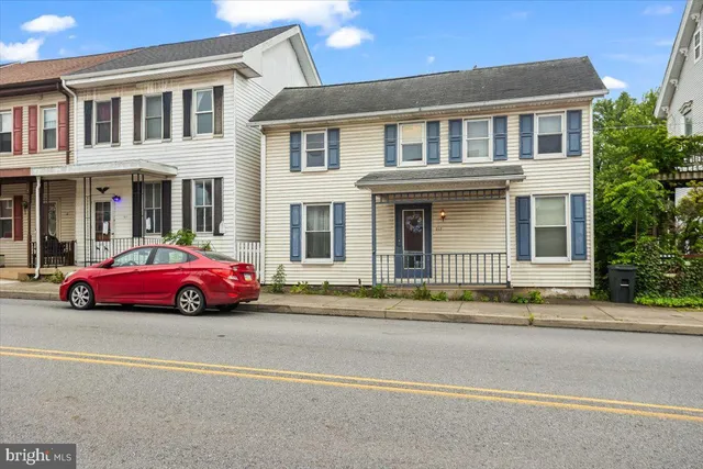 a car parked in front of a house