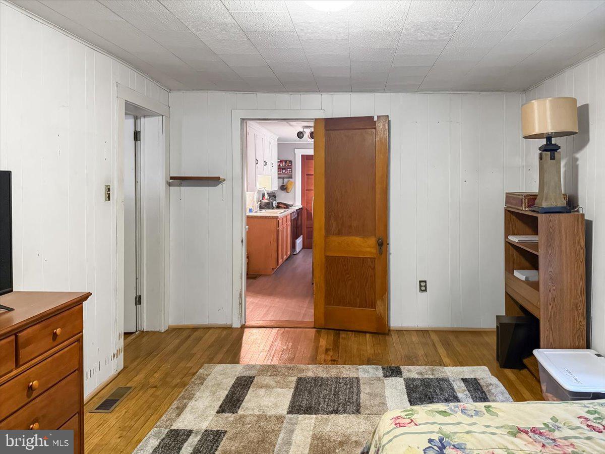 217 Market Street Halifax, PA 17032 - Photo 24 of 35 a bedroom with a bed and wooden floor