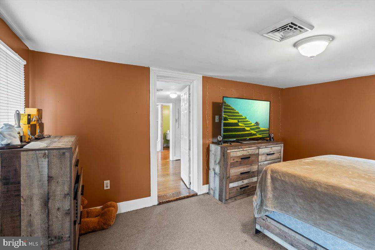 217 Market Street Halifax, PA 17032 - Photo 27 of 35 a bedroom with a bed and a flat screen tv