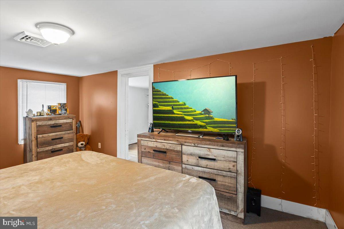 217 Market Street Halifax, PA 17032 - Photo 28 of 35 a bedroom with a bed and a flat screen tv