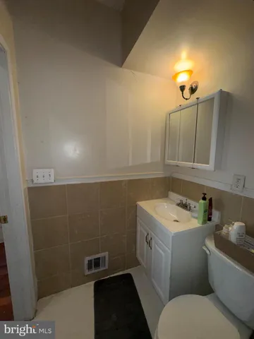 a room with pool table and windows