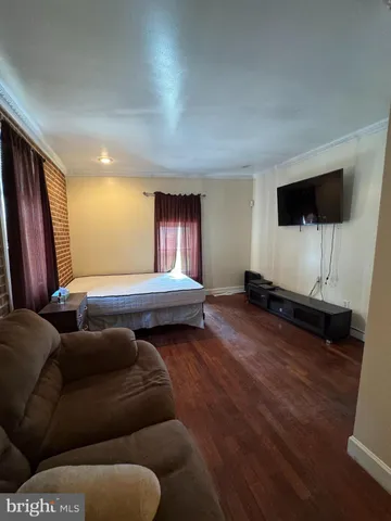 a living room with furniture and a lamp