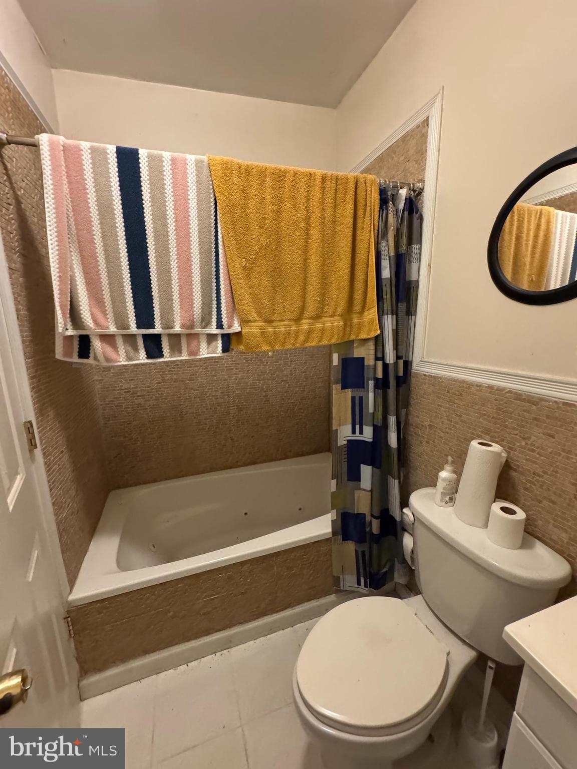 200 South Parrish Street Baltimore, MD 21223 - Photo 7 of 21 a white toilet sitting next to a bathroom sink and tub