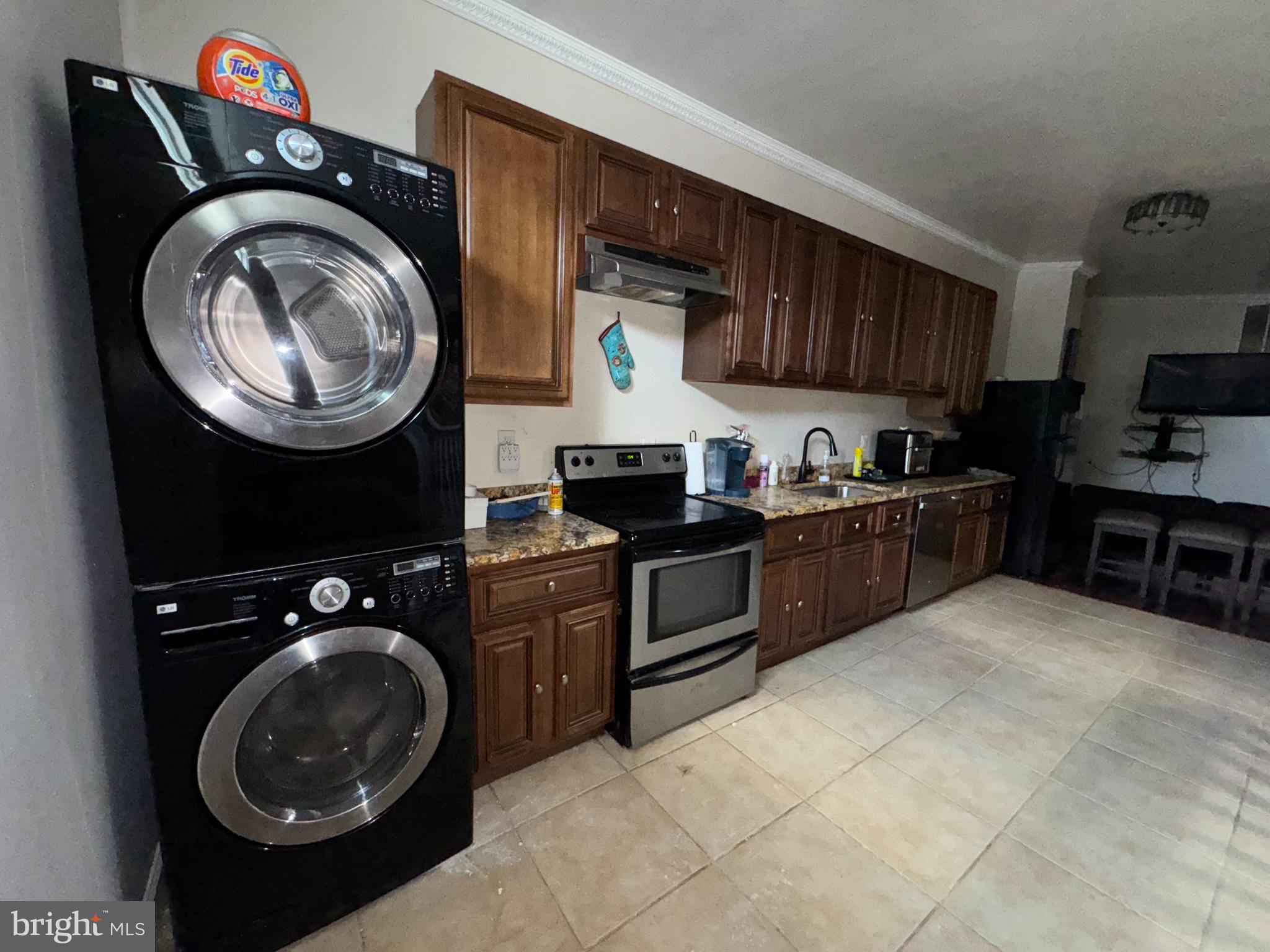 200 South Parrish Street Baltimore, MD 21223 - Photo 9 of 21 a kitchen with a stove a sink and a stove