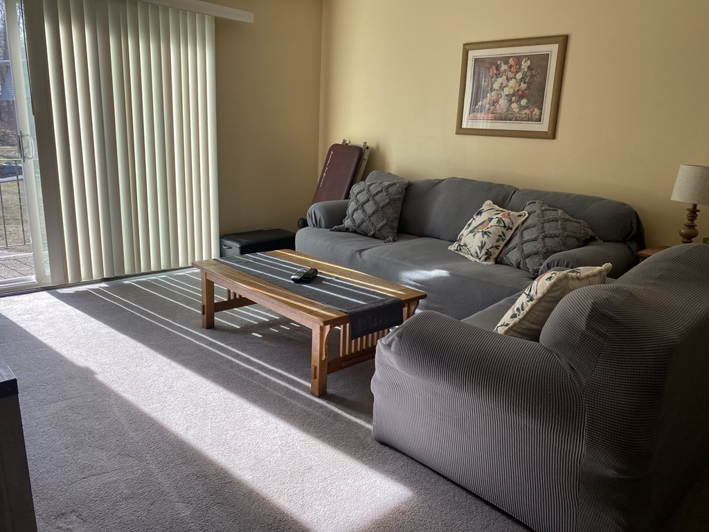 176 Maple Avenue, Unit 531 Rutland, MA 01543 - Photo 3 of 13 a living room with furniture and a window