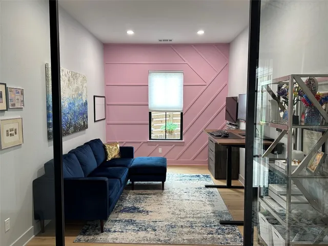 a living room with furniture bathtub and a window