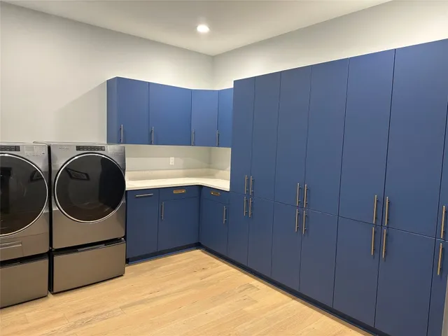 a kitchen with a refrigerator and a sink